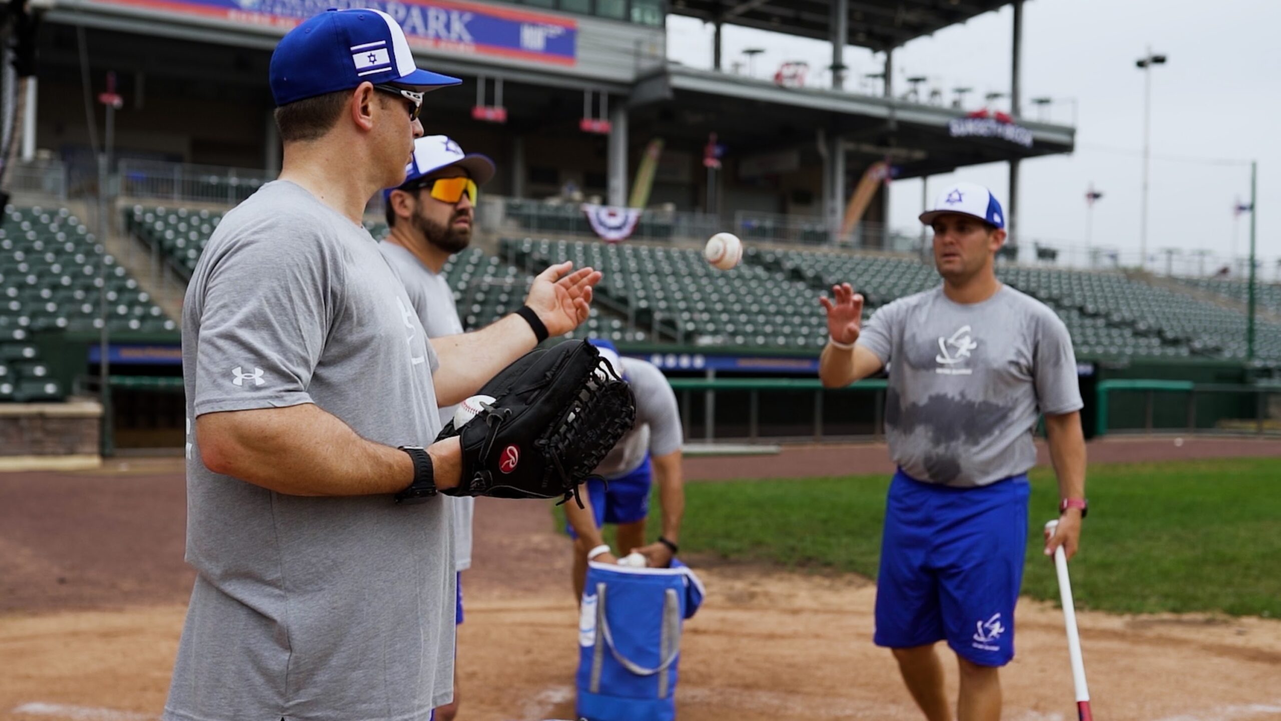 team israel baseball players throwing and catching a ball